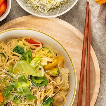 Soup Noodles with colorful vegetables in coconut milk curry sauce